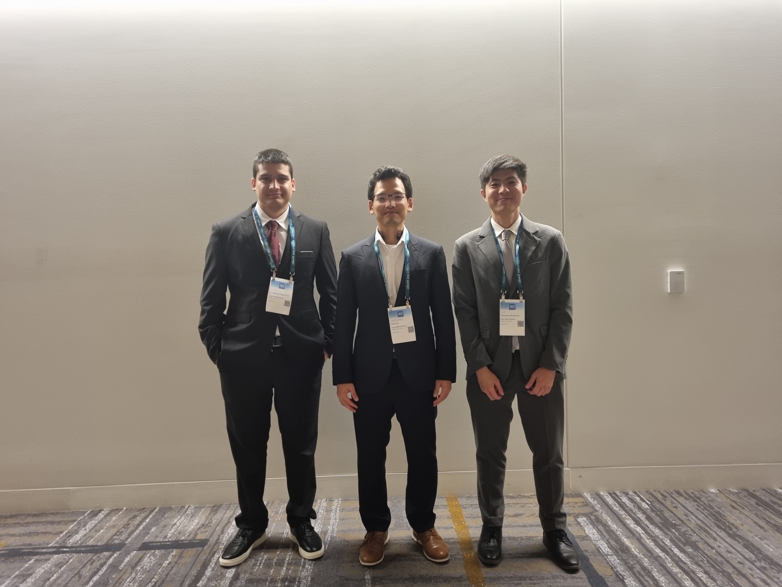 Sina Aghaee Dabaghan Fard standing with the INFORMS conference sign.