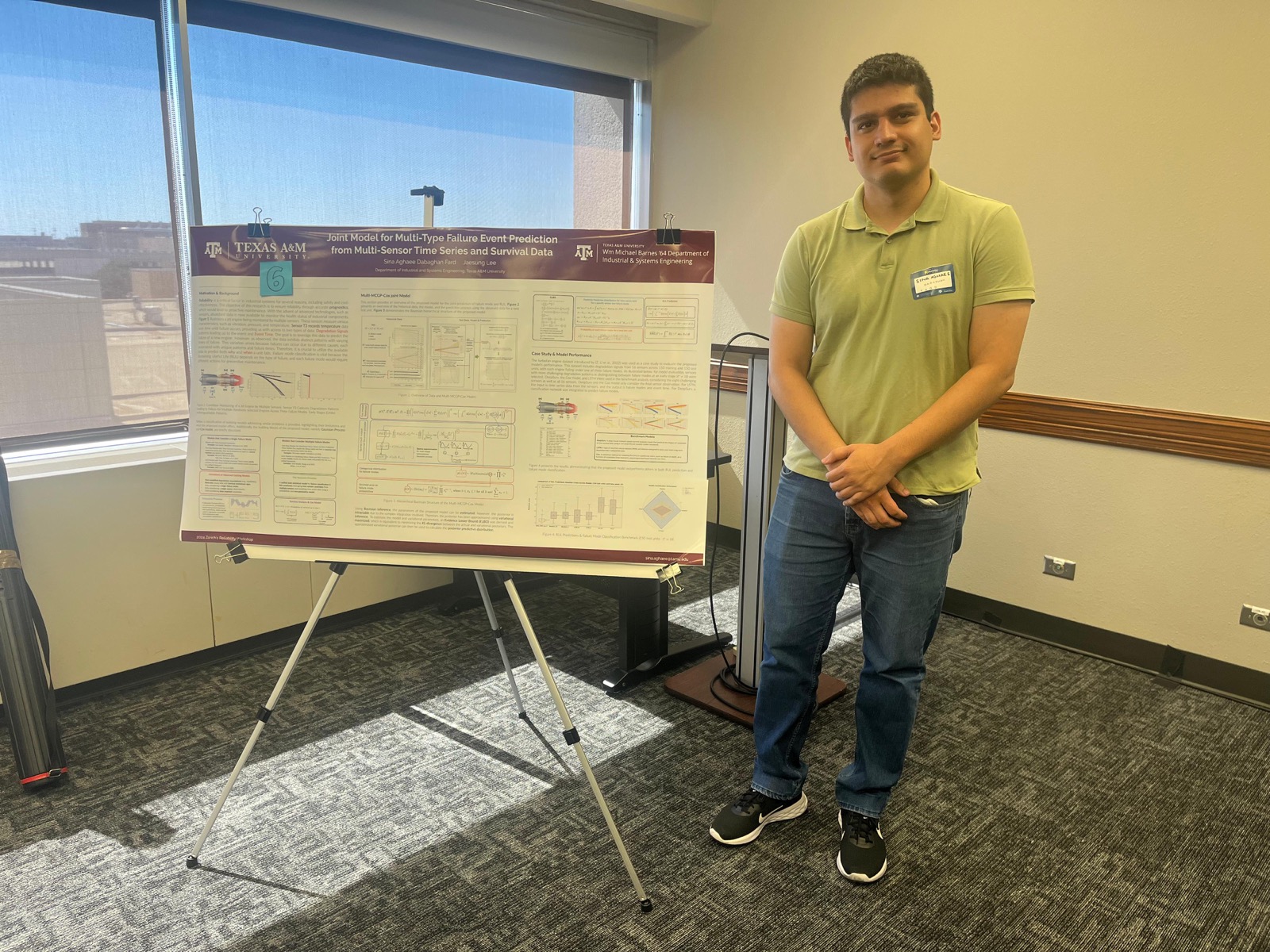 Sina Aghaee Dabaghan Fard with his research poster at the Zorich Reliability Workshop.